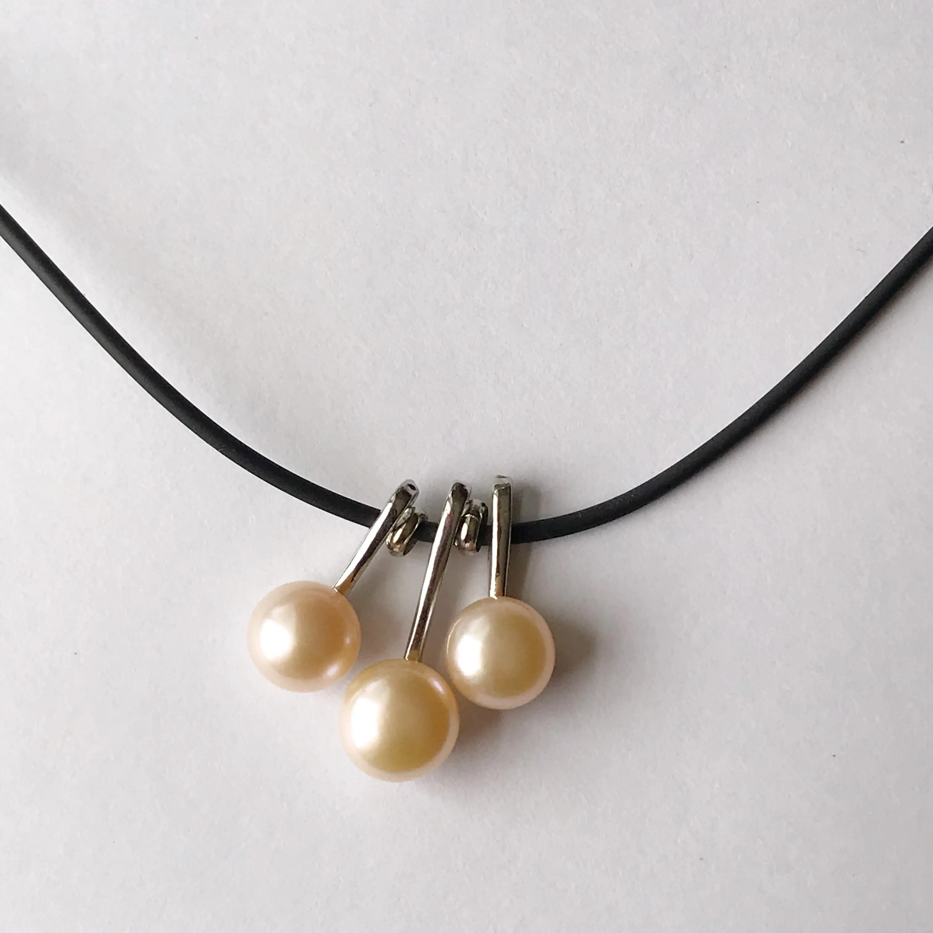 3 pearl necklace on a leather cord  necklace