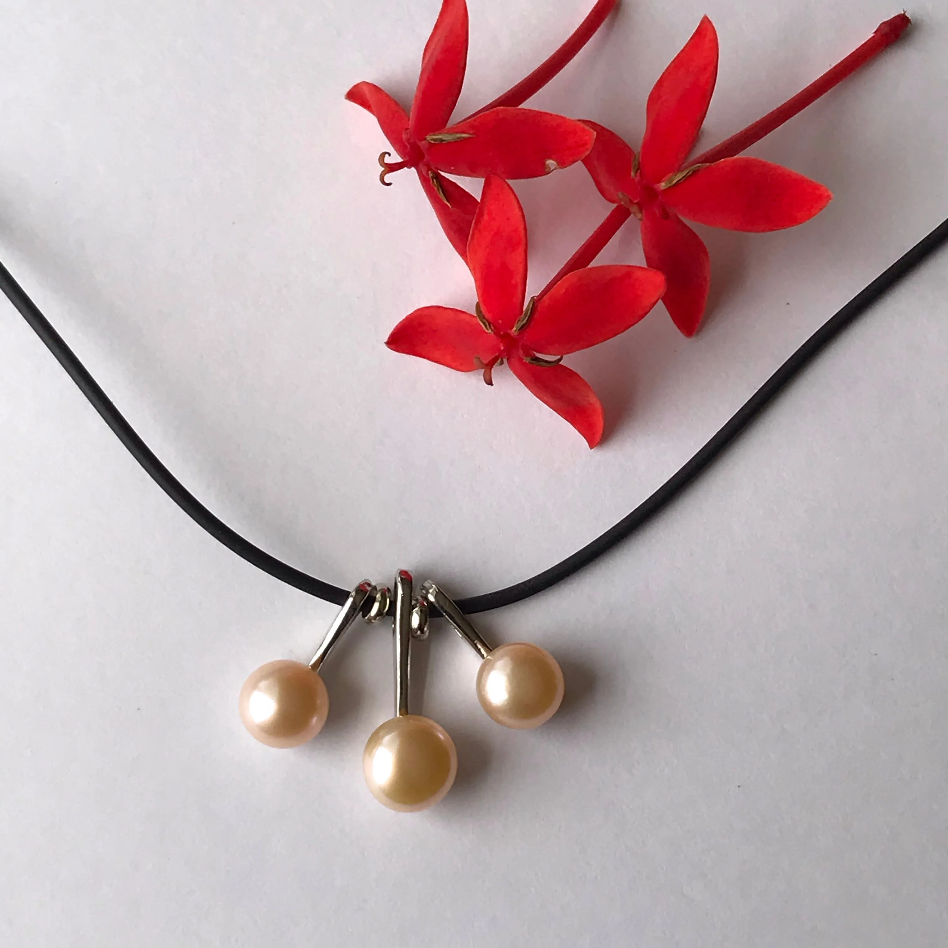 3 pearl necklace on a leather cord  necklace