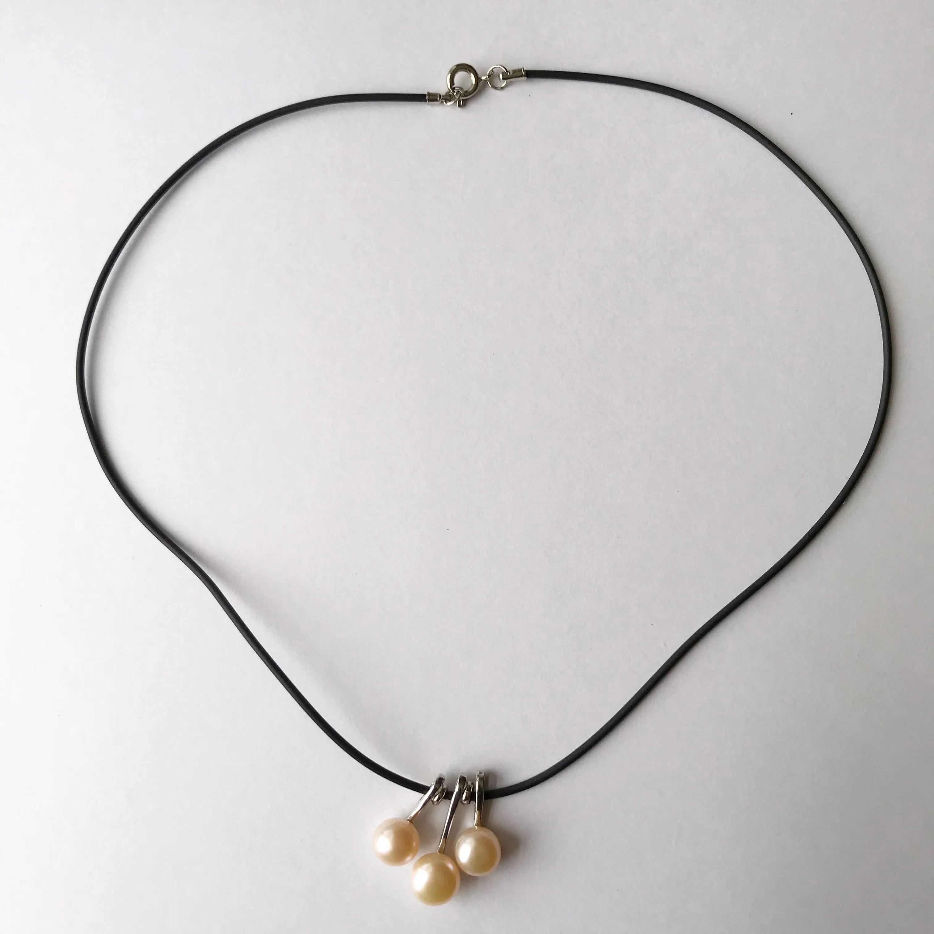 3 pearl necklace on a leather cord  necklace