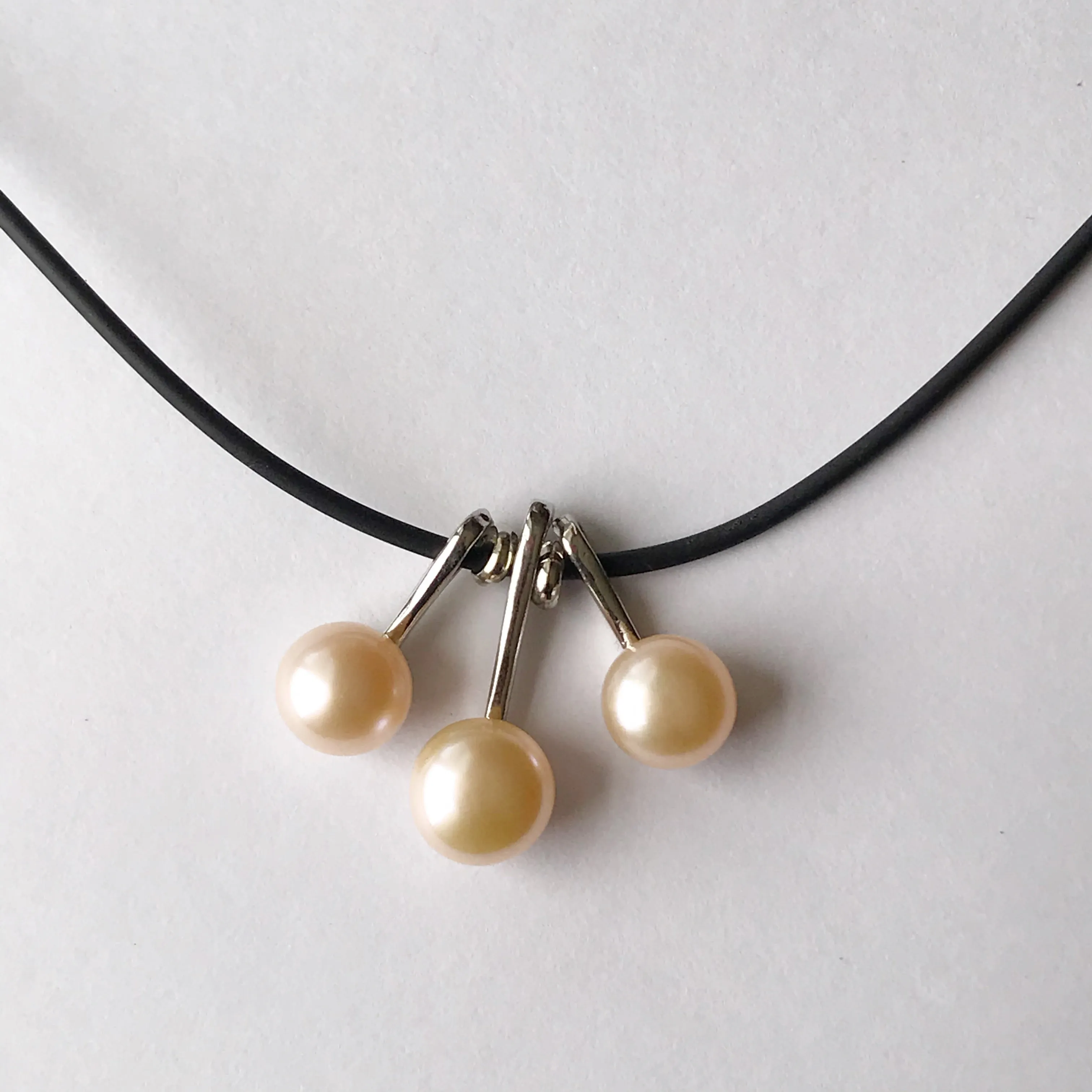 3 pearl necklace on a leather cord  necklace