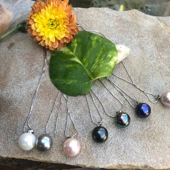 Large black mother of single pearl on silver chain