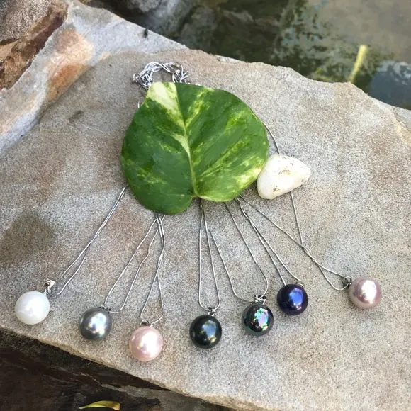 Large black mother of single pearl on silver chain
