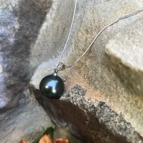 Large black mother of single pearl on silver chain