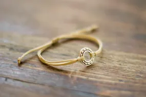 Silver Karma bracelet, beige cord, adjustable sliding knot