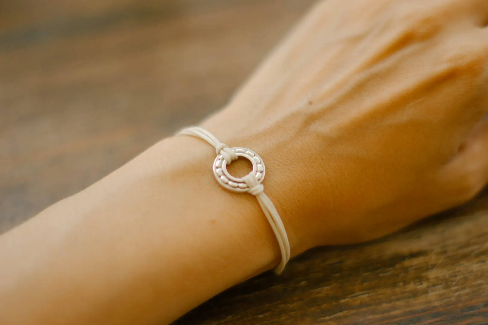 Silver Karma bracelet, beige cord, adjustable sliding knot